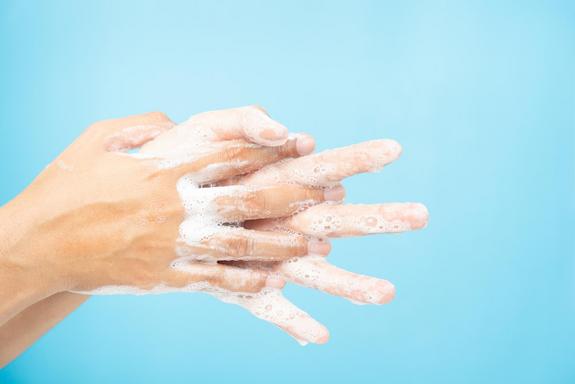 Close up of Asian women Cleaning hands with white soap bubbles o
